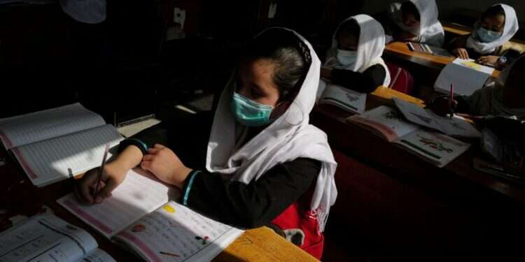 Girls attend a class in Kabul, Afghanistan, October 25, 2021 Taliban to open high schools for girls next week, official says
