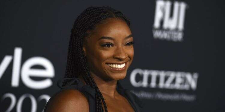 Simone Biles arrives at the InStyle Awards at The Getty Center in Los Angeles, Nov. 15, 2021 Gymnastics superstar Simone Biles chooses 2 dresses by Israeli designer for her wedding day