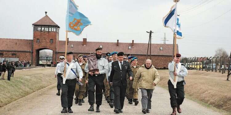 An IDF delegation at Auschwitz, Poland IDF to end Holocaust delegations to Poland, chooses Lithuania instead