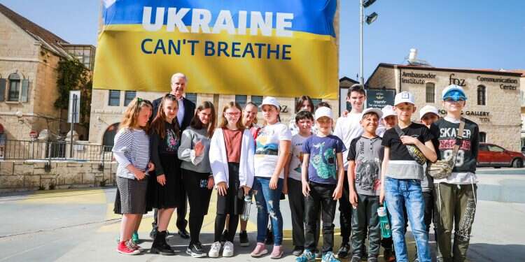 Mike Evans with children from Ukraine Mike Evans launches global campaign to mobilize support for Ukraine