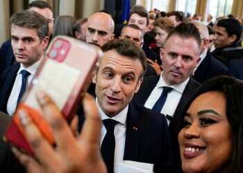 French President Emmanuel Macron on the campaign trail ahead of the election, March 18, 2022 Economic record, Ukraine war could help Macron defeat resurgent Le Pen