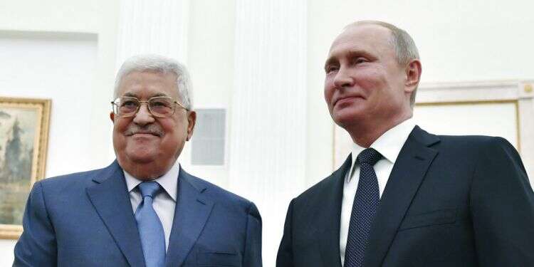 Palestinian Authority President Mahmoud Abbas shakes hands with Russian President Vladimir Putin at the Kremlin in Moscow, July 14, 2018 Putin rejects Israeli actions on the Temple Mount in phone call with Abbas