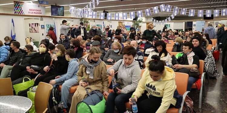 New immigrants and refugees from Ukraine wait to be 'checked in' at Ben-Gurion International Airport on March 14, 2022 Poll reveals immigrants' surprising attitude toward conversion reform