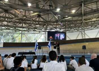 Teenage Israeli cyclists mark the Holocaust Remembrance Day at the Sylvan Adams Velodrome, Tel Aviv, April 27, 2022 Teenage Israeli cyclists mark Holocaust Remembrance Day