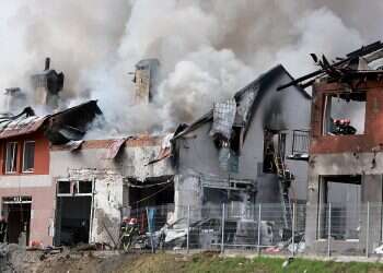 Firefighters battle a blaze after a civilian building was hit by a Russian missile, April 18, 2022 in Lviv, Ukraine Ukraine vows to 'fight to the end' as Russian strikes kill at least 7 in Lviv