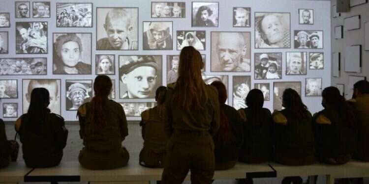IDF soldiers tour the 'Before My Very Eyes' Holocaust education center at the Ariel Sharon training base in southern Israel