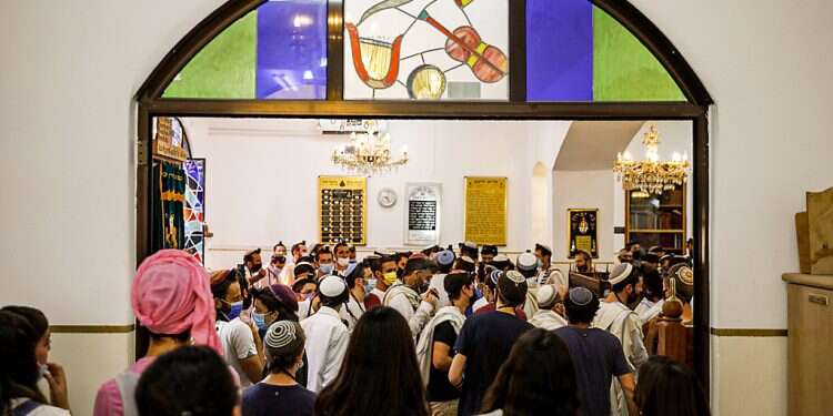 Worshippers pray at a synagogue in the Nachlaot neighborhood of Jerusalem Under extra security, synagogues in Israel and abroad prepare for Passover