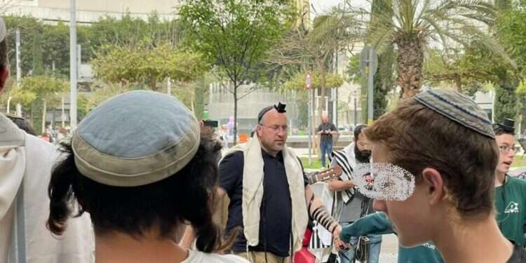 Worshippers pray at site of deadly Tel Aviv attack