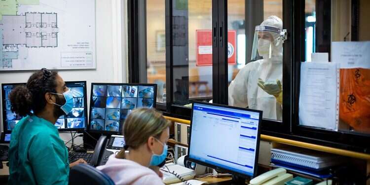 Medical staff at the dedicated unit for psychiatric COVID patients at Sheba Medical Center at Tel Hashomer, April 30, 2020 Psychiatric patients in Israel at greater risk from COVID, study finds