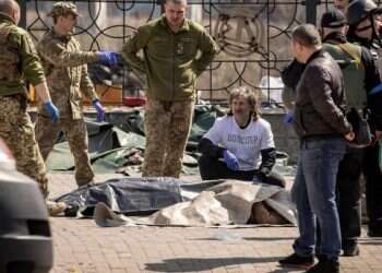 Ukrainian soldiers clear out bodies after a rocket attack killed at least 35 people on April 8, 2022 at a train station in Kramatorsk, eastern Ukraine, that was being used for civilian evacuations Russian missile kills 30 civilians at train station, Ukraine says