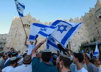 Police determined to allow flag march to proceed as planned despite Hamas threats