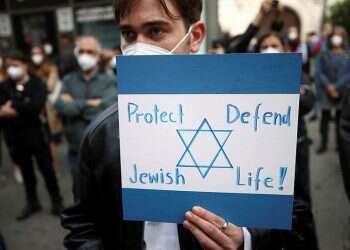 A pro-Israel demonstrator holds a placard during a protest following the violence between Israel and Palestinians, in Vienna, Austria, May 15, 2021 Austria records nearly 1,000 antisemitic incidents in 2021