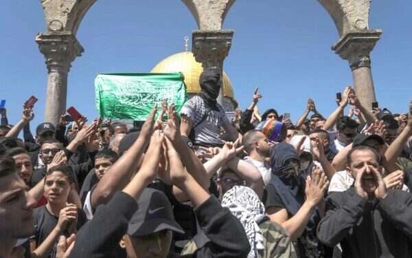 Arab protesters burn Israeli flag on Temple Mount in Jerusalem