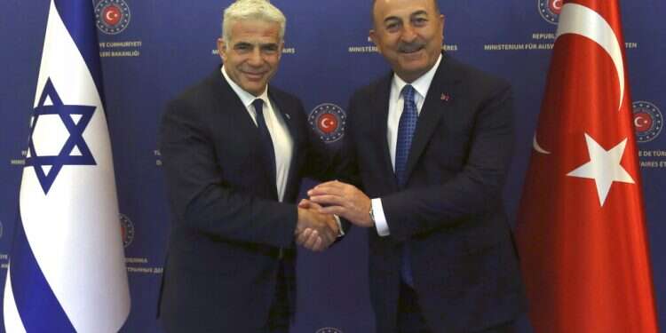 Turkish Foreign Minister Mevlut Cavusoglu, right, and Israeli Foreign Minister Yair Lapid in Ankara, Turkey, Thursday, June 23, 2022 Turkey, Israel seek to bolster ties amid ongoing counterterrorism effort