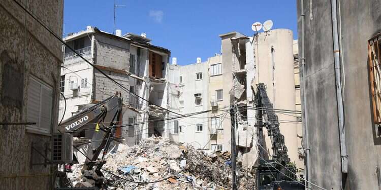 The scene of a collapse of an aging building in the Tel Aviv suburb of Holon, Sept. 13, 2021 Hundreds of aging buildings uninsured for collapse