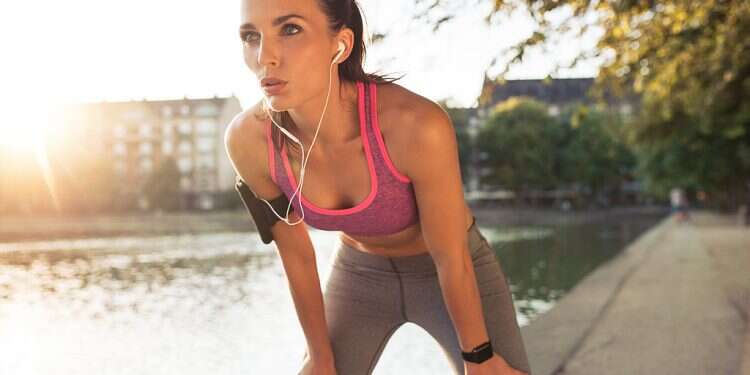 Young sportswoman resting after run Young sportswoman resting after run