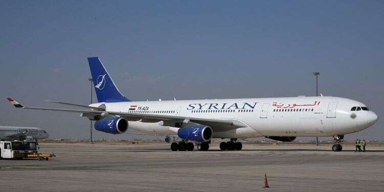 A SyrianAir Airbus A340-300 is pictured at Damascus International Airport on Oct. 1, 2020 Damascus International Airport suspends all flights following alleged Israeli airstrikes