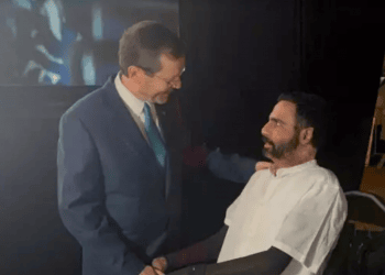 President Isaac Herzog shakes hands with Itzik Saidyan at an event for the Friends of Sheba Medical Center on June 19, 2022 PTSD-stricken IDF vet who set himself on fire makes first public appearance
