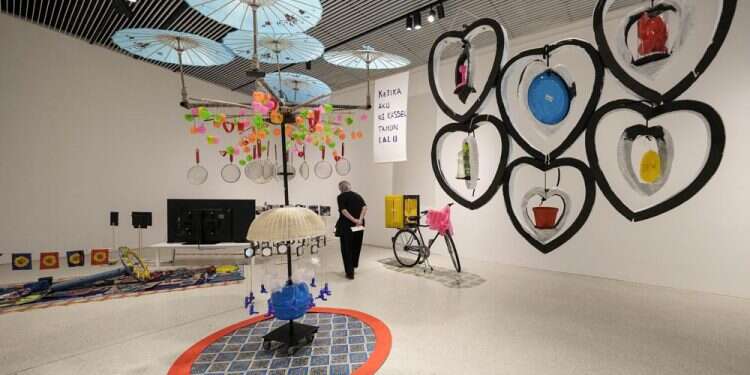 A visitor walks during an exhibition of artist Agus Our Amal PMTOH from Indonesia during the press preview of the documenta 15, in Kassel, Germany, June 15, 2022 Major German art show launches amid antisemitism allegations