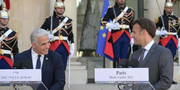 In first international trip, Lapid praises Macron on Iran
