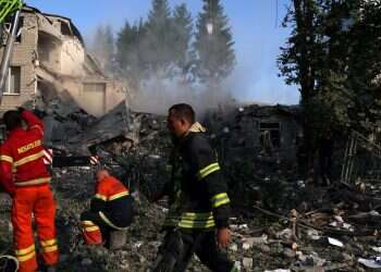 First responders work on the scene where a school was destroyed by early morning shelling as Russia's attack on Ukraine continues in Kharkiv, Ukraine, July 4, 2022 Russia claims major victory after fall of Luhansk; war to shift to Donetsk