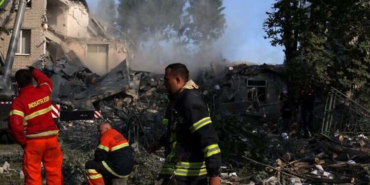 First responders work on the scene where a school was destroyed by early morning shelling as Russia's attack on Ukraine continues in Kharkiv, Ukraine, July 4, 2022 Russia claims major victory after fall of Luhansk; war to shift to Donetsk
