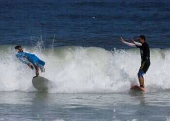 With eyes on the waves, Gaza surfers keep boards handy