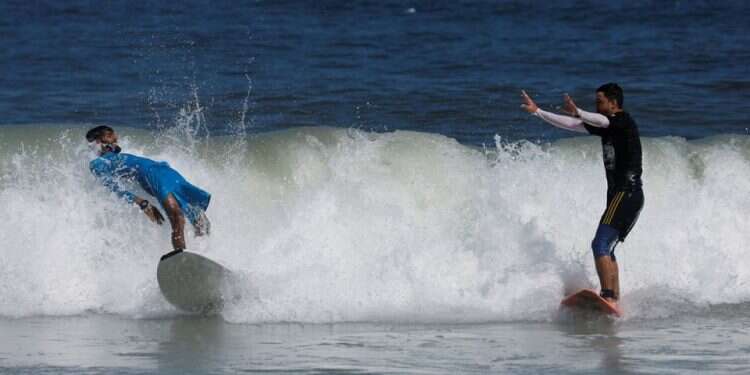 With eyes on the waves, Gaza surfers keep boards handy
