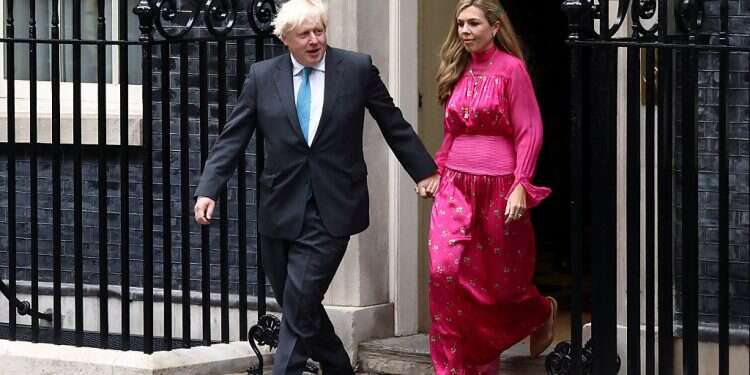 Outgoing British Prime Minister Boris Johnson, with his wife Carrie Johnson, arrives to deliver a speech on his last day in office, outside Downing Street Johnson says he is 'like a booster rocket that has fulfilled its function'