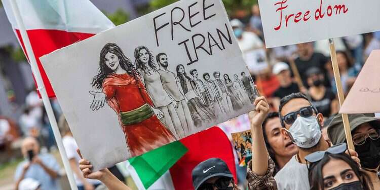 Demonstrators march during a protest for Mahsa Amini who died in custody of Iran's morality police, in front of the Los Angeles City Hall, Los Angeles, California, Oct. 1, 2022 'They're not alone:' Iranian-Americans support protesters for regime change