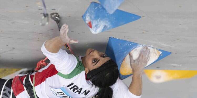 Iranian athlete Elnaz Rekabi competes during the women's Boulder & Lead final during the IFSC Climbing Asian Championships in Seoul, Oct. 16, 2022 Iranian climber who competed without hijab gets hero's welcome at home