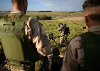 A member of the British armed forces teaches a group of Ukrainian volunteers how to use a FGM-148 Javelin surface-to-air missile, Oct. 11, 2022, United Kingdom Russia to evacuate 'annexed' Kherson residents as Ukraine advances