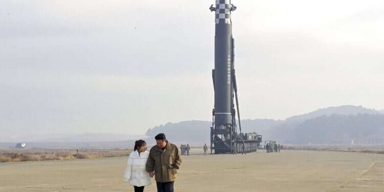 North Korean leader Kim Jong Un, right, and his daughter inspect the site of a missile launch at Pyongyang International Airport in Pyongyang, North Korea, Friday, Nov. 18, 2022 Kim Jong Un's daughter appears in public for first time