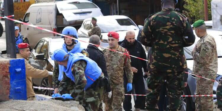 Irish UN peacekeepers and Lebanese soldiers investigate the scene where gunfire came on a UN peacekeeper convoy in the Al-Aqbiya village, south Lebanon, Thursday, Dec. 15, 2022 UN peacekeeper killed after attack in southern Lebanon