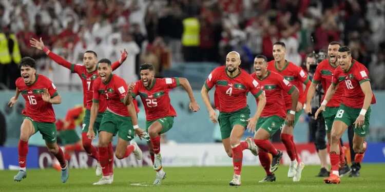 Morocco's players celebrate after the penalty shootout at the World Cup round of 16 soccer match between Morocco and Spain, at the Education City Stadium in Al Rayyan, Qatar, Dec. 6, 2022 Morocco becomes first Arab nation to make World Cup quarterfinals
