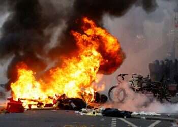 Kurdish protest over Paris shooting turns violent