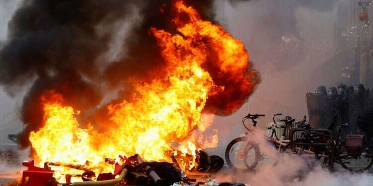 Kurdish protest over Paris shooting turns violent