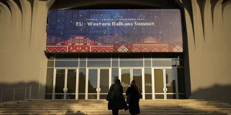 People walk outside the venue of the EU Western Balkans Summit, in Tirana, Albania, Dec. 5, 2022 EU, Western Balkans to boost partnership amid Ukraine war