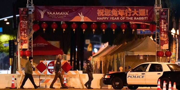 FBI agents walk near a scene where a shooting took place in Monterey Park, California LA gunman kills 10 near Lunar New Year fest