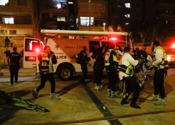 First responders treat the victims at the Jerusalem shooting attack on January 27, 2022