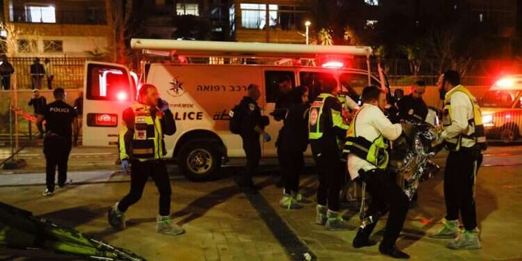 First responders treat the victims at the Jerusalem shooting attack on January 27, 2022