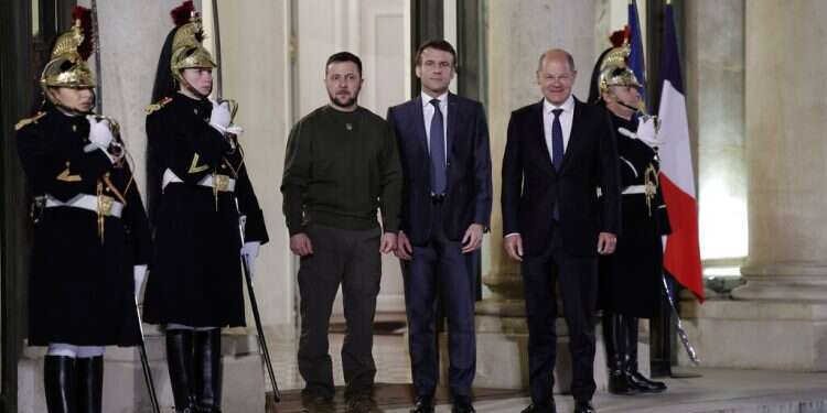 French President Emmanuel Macron, center, poses with Ukrainian President Volodymyr Zelenskyy, left, and German Chancellor Olaf Scholz at the Elysee Palace on Feb. 8, 2023 in Paris Zelenskyy wraps up European tour with visit to EU summit