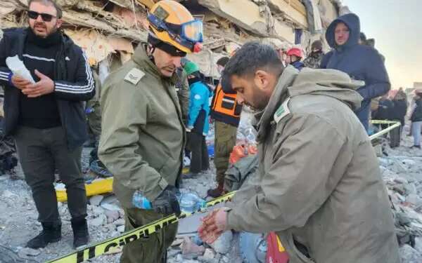 Israeli rescuers pull survivors from rubble after complex on-site amputation