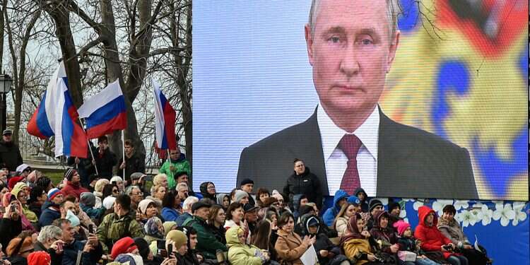 Facing arrest warrant, Putin visits annexed territories
