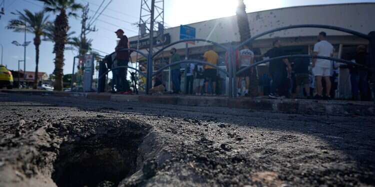 The crater from an intercepted rocket fired from Lebanon that landed in northern Israel Thursday, April 6, 2023 Israel blames Hamas for dozens of rockets launched from Lebanon
