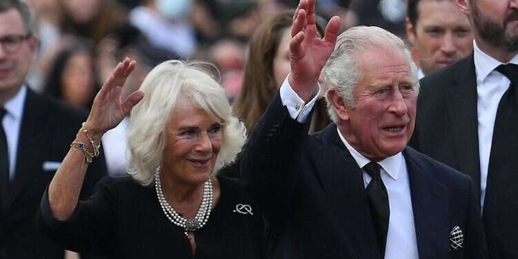 Britain's King Charles III (R) and Britain's Camilla, Queen Consort wave as they greet the crowd upon their arrival Buckingham Palace in London, Sept 9, 2023 'King Charles has never been a role model or idol, in stark contrast to his mother'