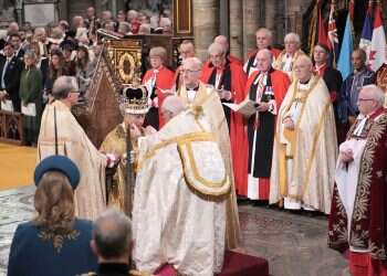 King Charles III crowned in ancient rite at uncertain moment