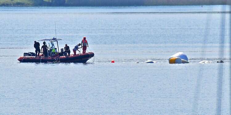 Carabinieri and fire brigade officers take part in the search and rescue operation in Lake Maggiore after a tourist boat capsized near Lisanza (Varese), northern Italy, 29 May 2023
Report: 10 ex-intel agents rushed back to Israel after Italy boat disaster