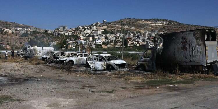 A picture shows burnt vehicles, reportedly set ablaze by Israeli settlers, in the area of in al-Lubban al-Sharqiya on June 21, 2023 US 'deeply concerned' amid deadly settler riots following Eli attack