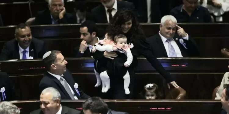 Haskel with her children at the Knesset MK Haskel causes legal morass after bringing baby along for Knesset speech